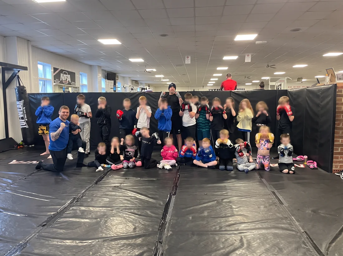 Jimmy and the children together at a GYMBAM combat and fitness class